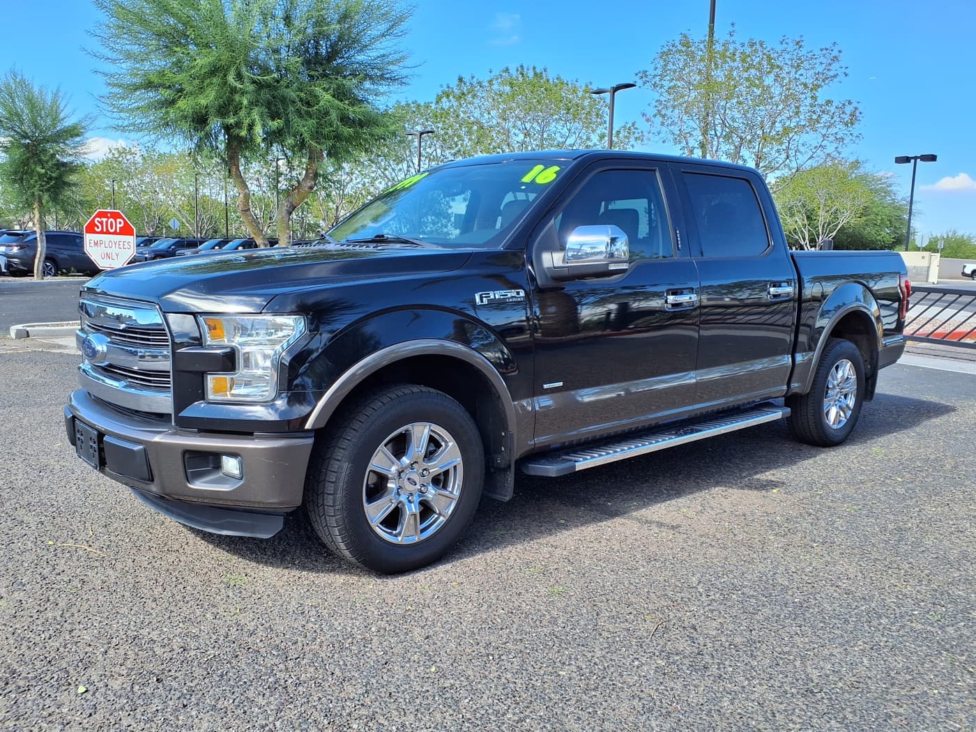 Black Ford F-150 Lariat pickup truck shown as a model reference